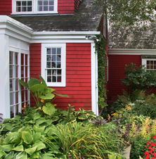 Close up of red house with garden
